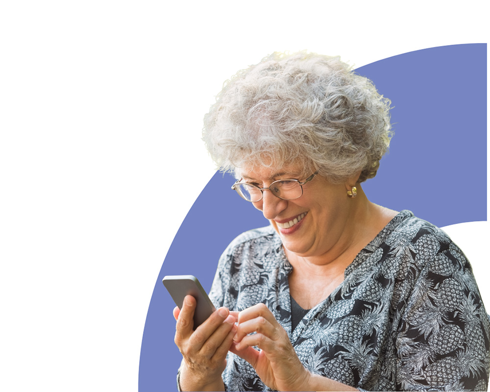 senior using a smartphone and smiling